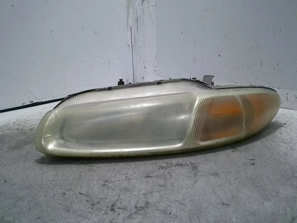 Foto de FARO IZQUIERDO CHRYSLER STRATUS JX CABRIO 2.5 CAT (163 CV / 120 KW) referencia 04630153